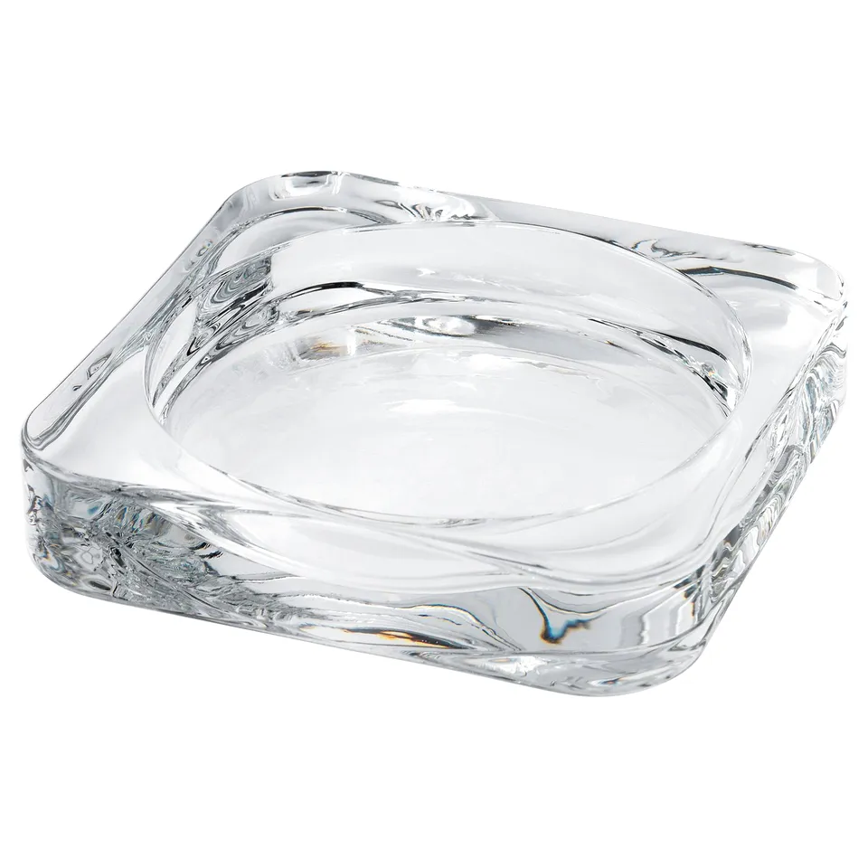 A clear, square-shaped glass candle dish with a wavy design, ideal for holding candles.