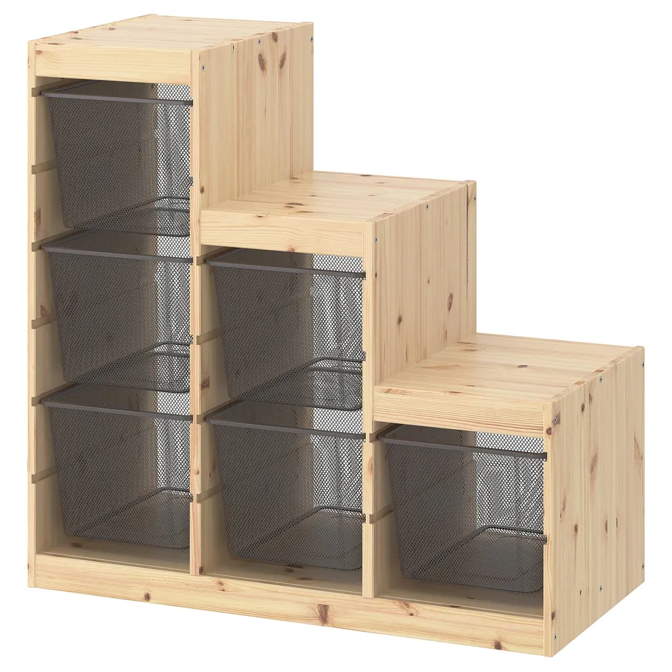 IKEA TROFAST storage: light wood, black mesh bins, tiered cube design for organising items.