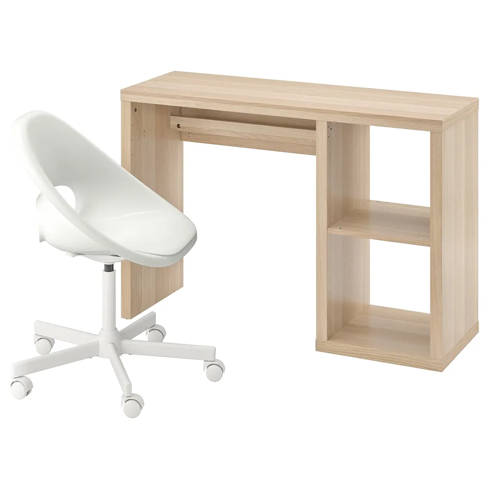 A white office chair and a light wood desk with open shelves.