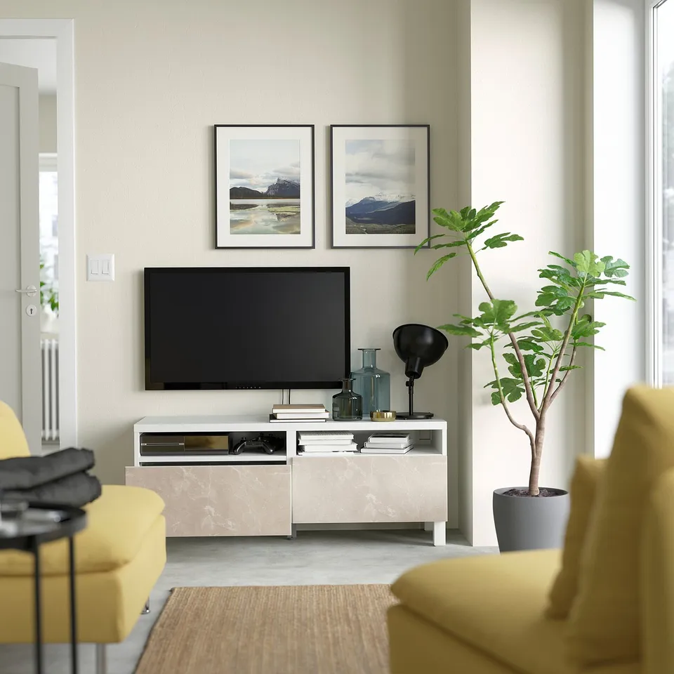 Modern living room with a BESTÅ tv stand, featuring cable management, soft-closing drawers, and a wide top for a 45 tv.