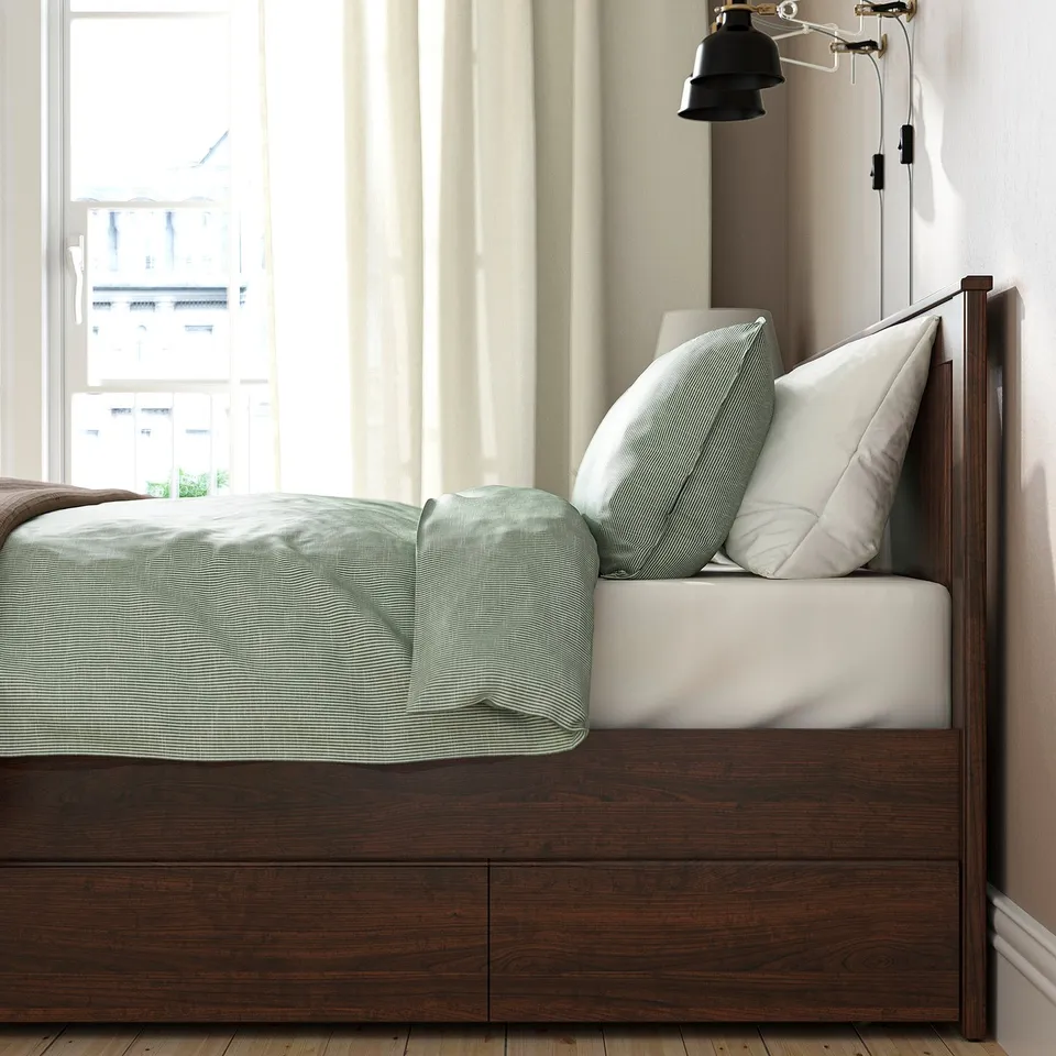 Bed: SONGESAND. Sturdy wood, high legs, soft edges. Under-bed storage shown.