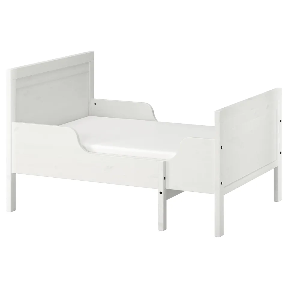 A white SUNDVIK toddler bed, made of pine and fiberboard, with a simple, rectangular design.