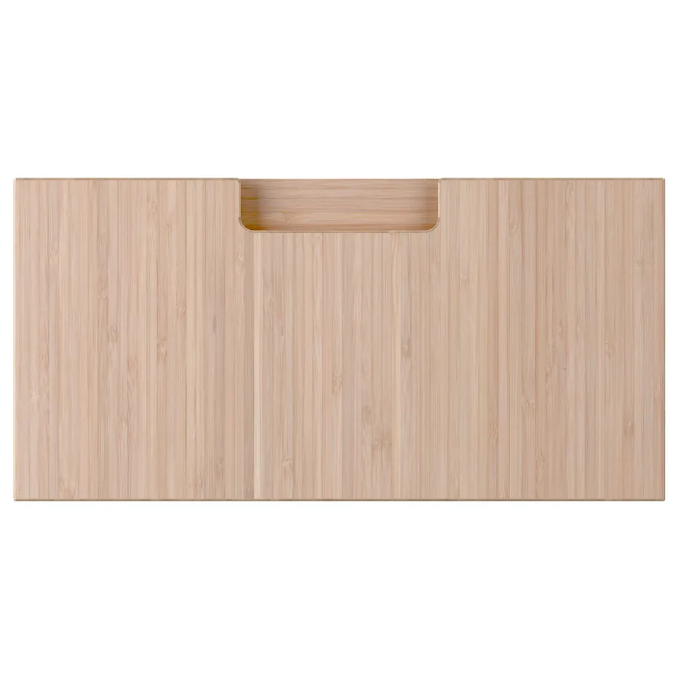 A natural bamboo FRÖJERED drawer front with integrated handles, exhibiting a sleek and modern design.