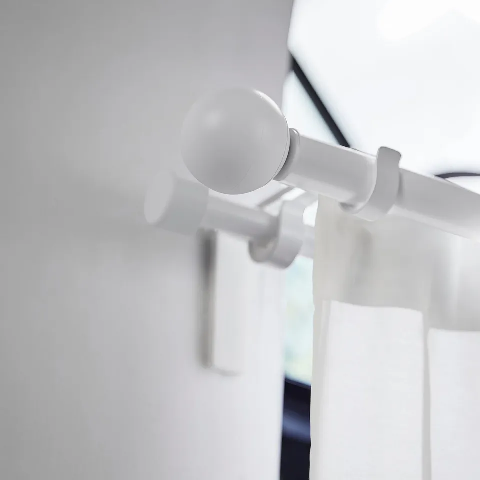 White plastic globe finial for curtains, modern & eco-friendly.