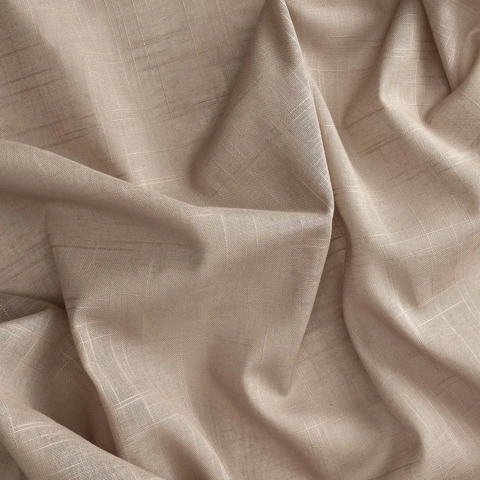 Beige cotton curtains diffusing light.
