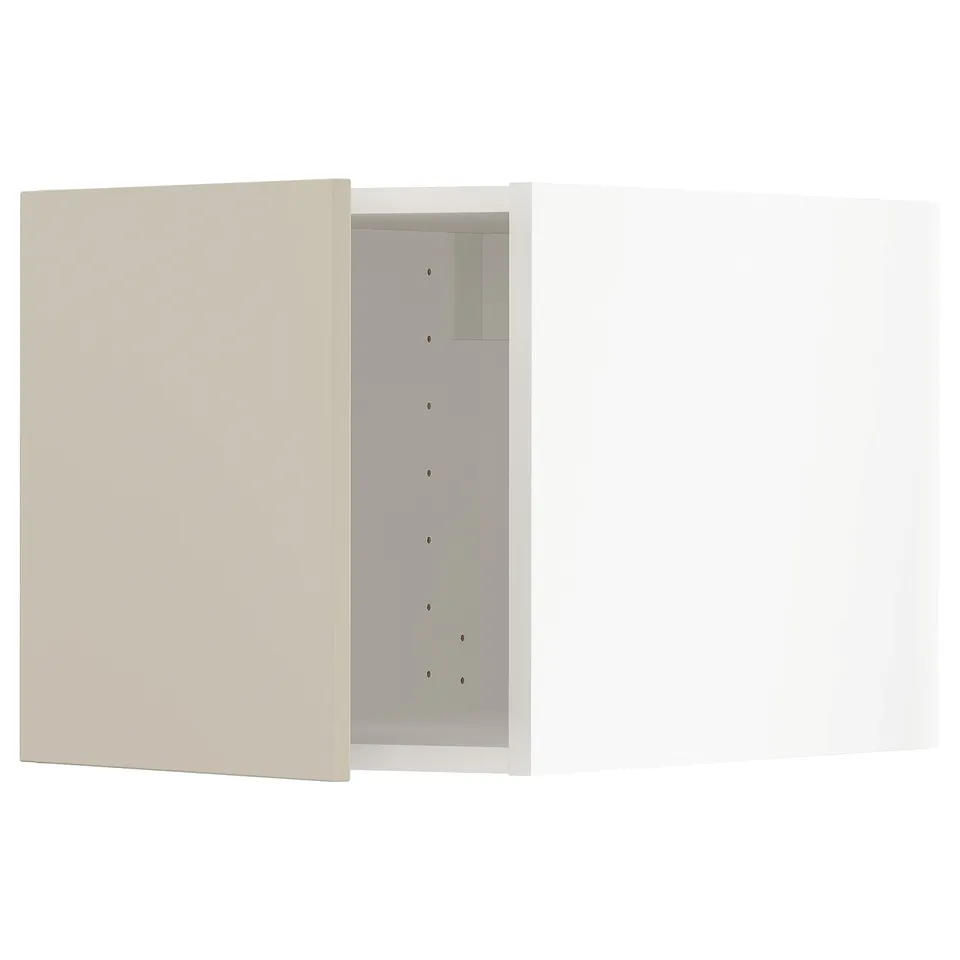 METOD kitchen in beige with sleek, modern design, featuring smooth surfaces and vertical line of drilled holes.