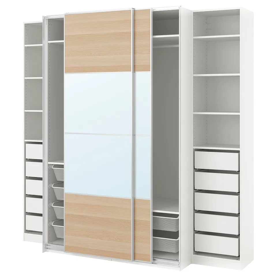 A white ikea PAX wardrobe with a mixed wood and mirror finish, featuring shelves and drawers for storage.