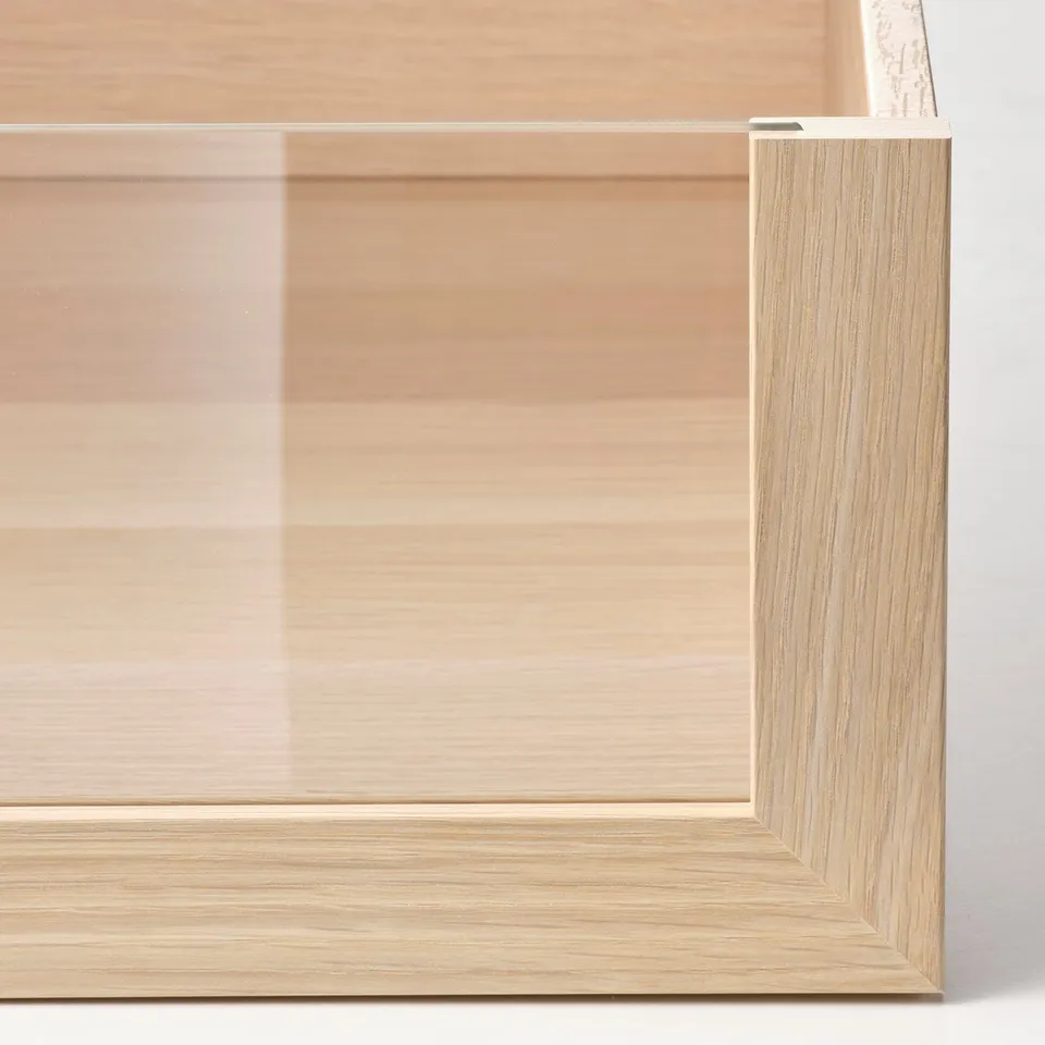 A close-up of a high-quality wooden drawer front with smooth, natural finish.