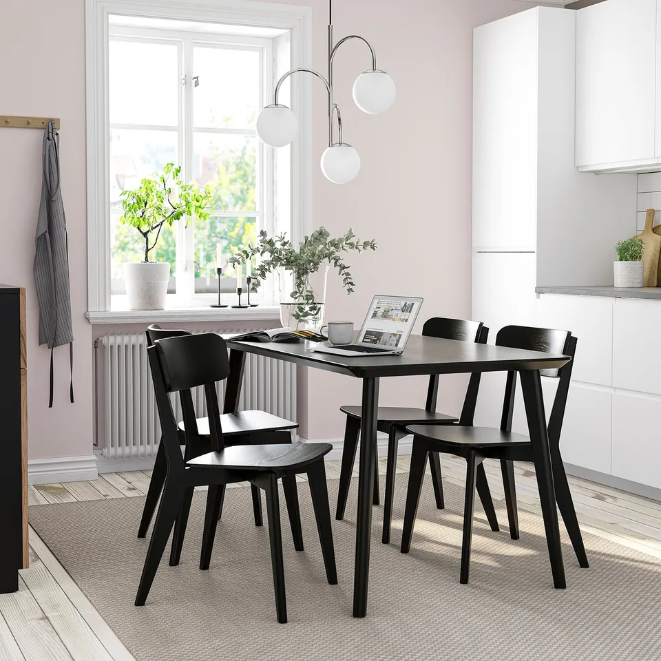 Modern dining set: black LISABO table & chairs, minimalist design, fits neatly under window.