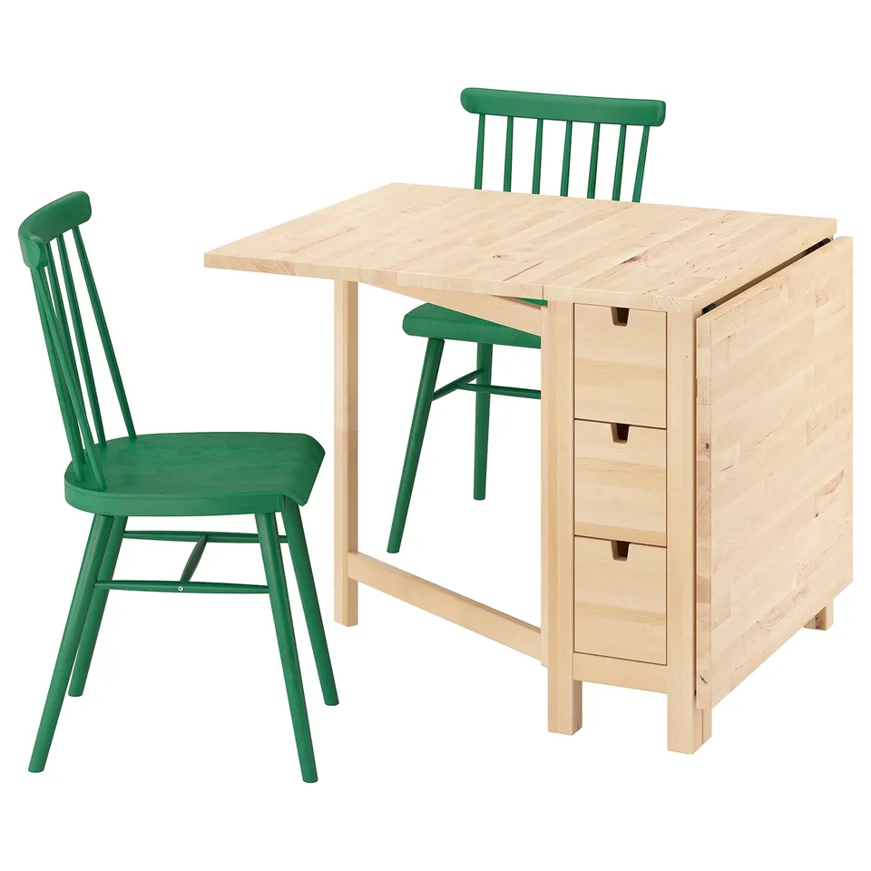 Nordic-style dining set: light wooden table with 6 drawers, green chairs. Simple, practical design for compact spaces.