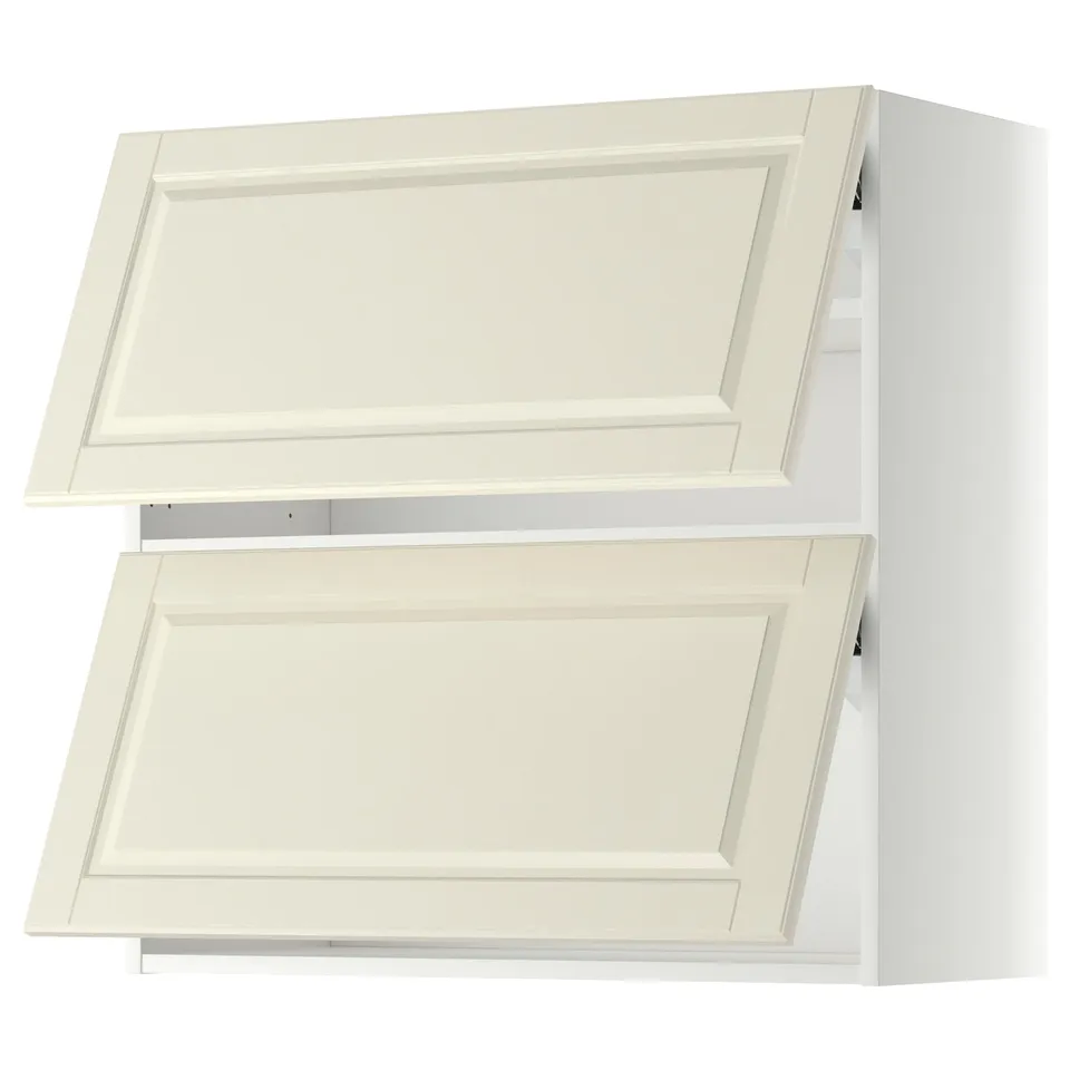 Two white overhead kitchen cabinets with bevelled edges and one open door revealing shelves.