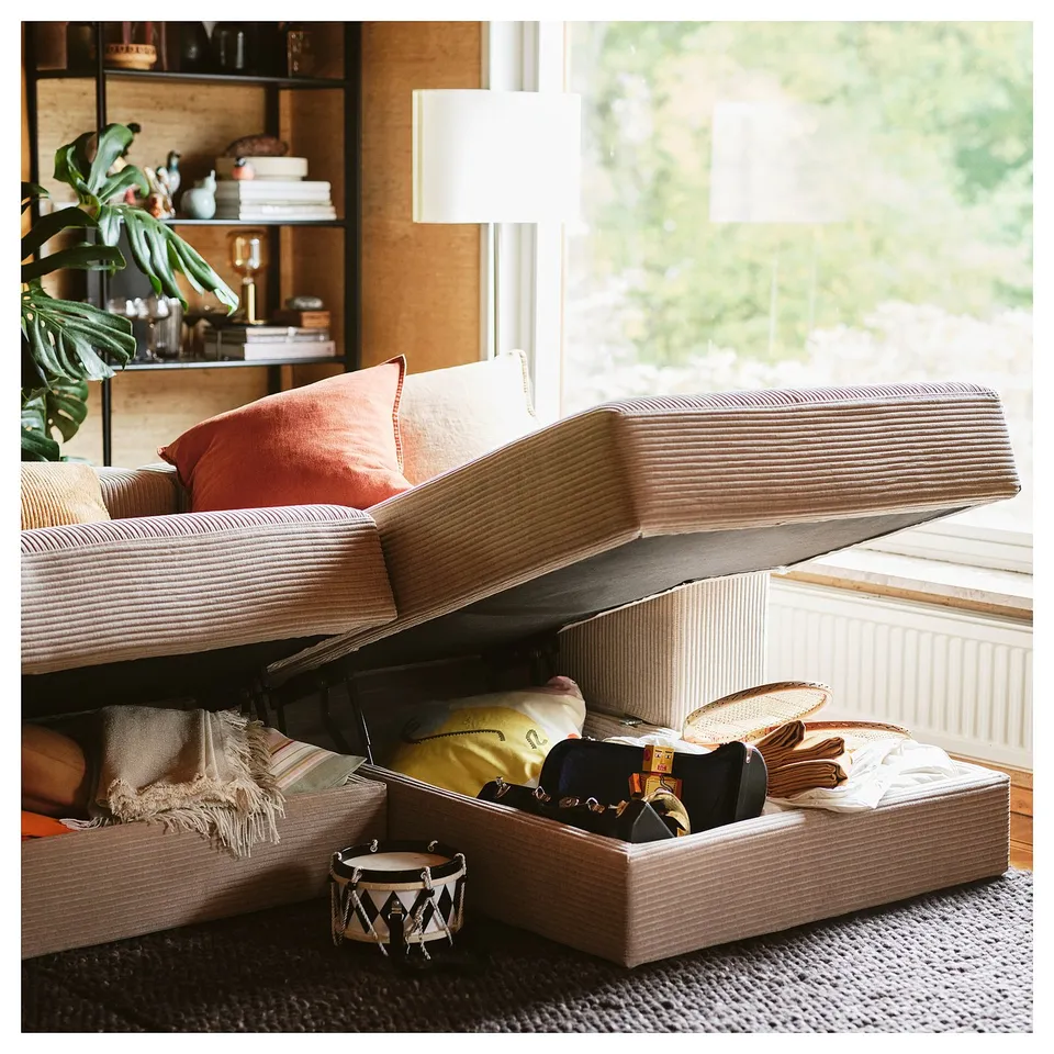 JÄTTEBO modular sofa with storage chaise, shelving, and plants.