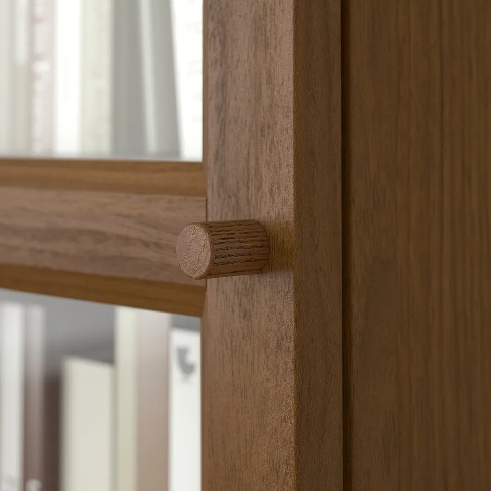 Wooden drawer handle, smooth texture, natural finish.