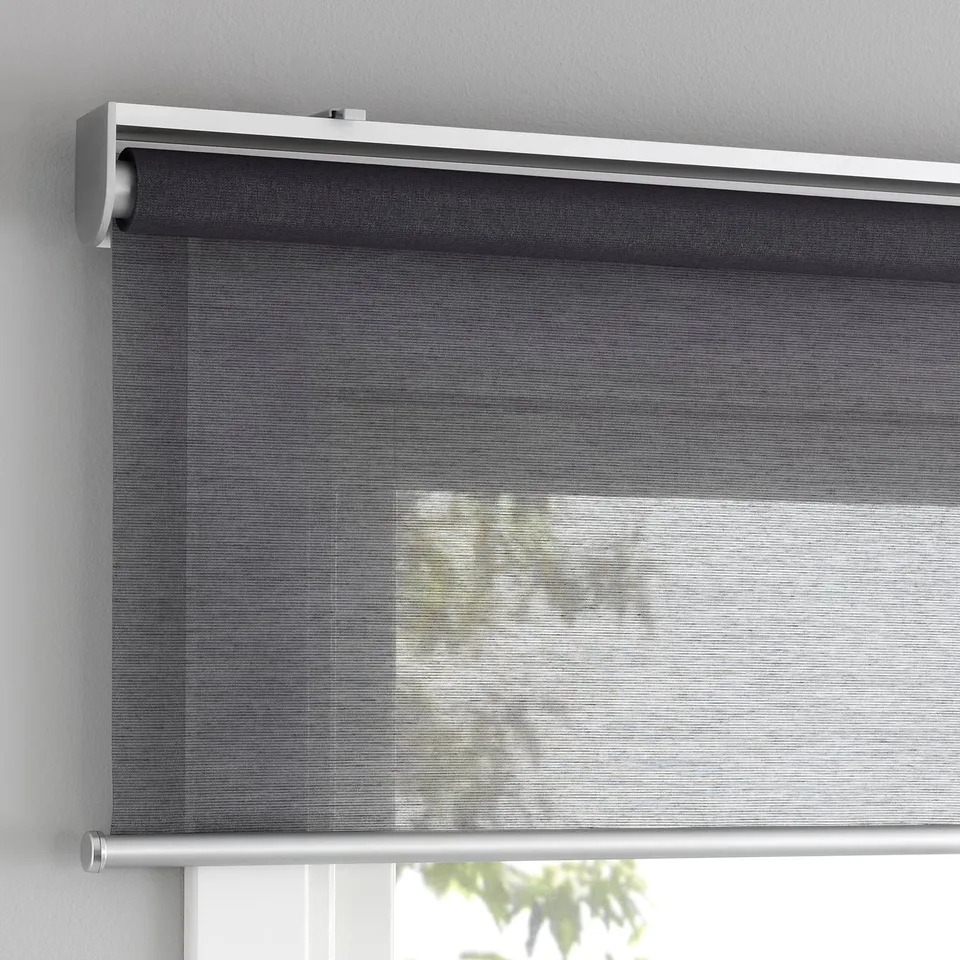 Cordless roller blind with soft close, mounted above window.