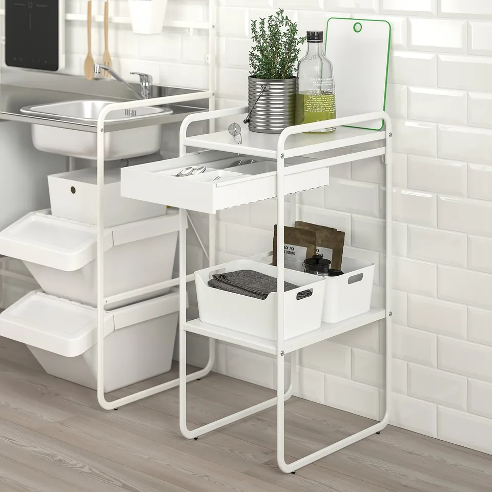 White SUNNERSTA trolley with shelves & drawers, neatly storing kitchen items.