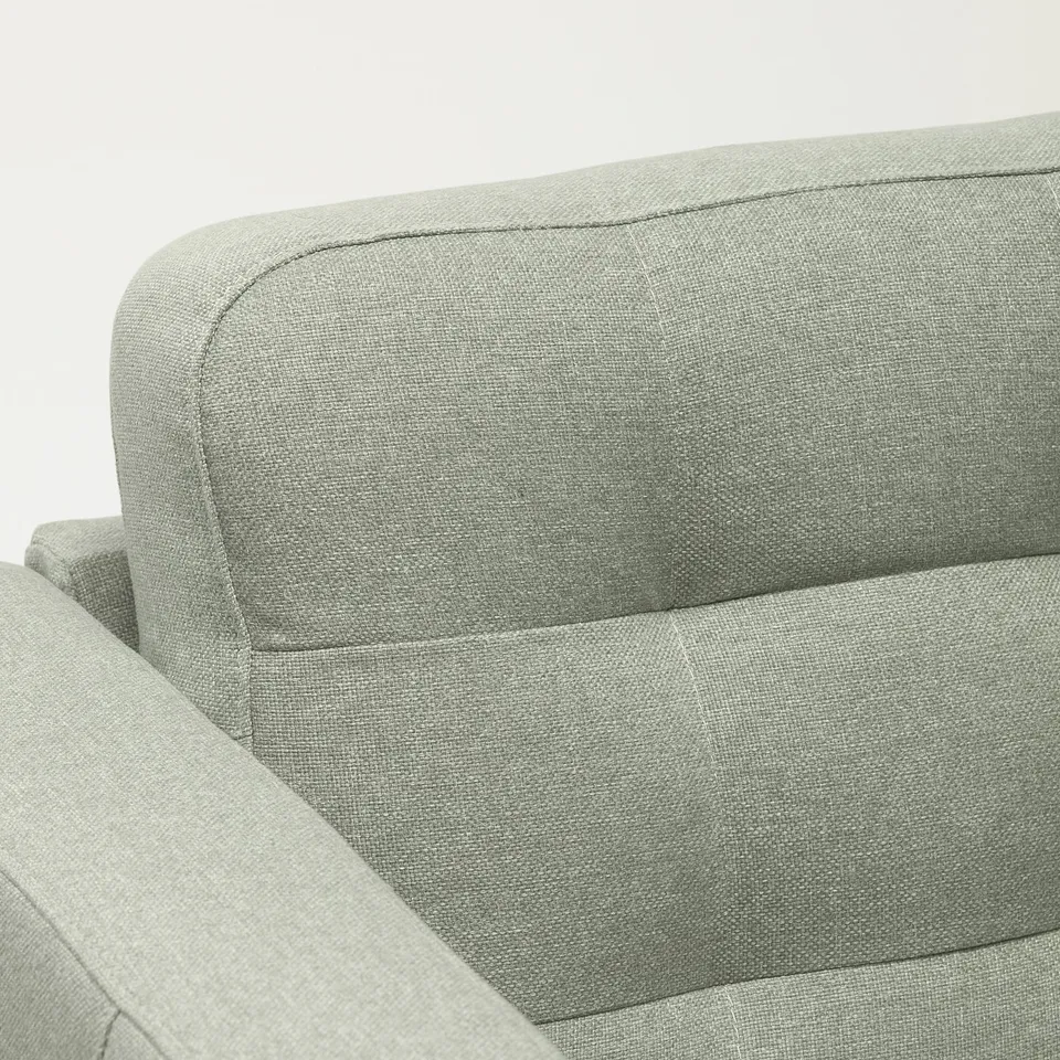 Light grey fabric sofa with soft, upholstered cushions. Clean lines and sturdy build, ideal for comfort.