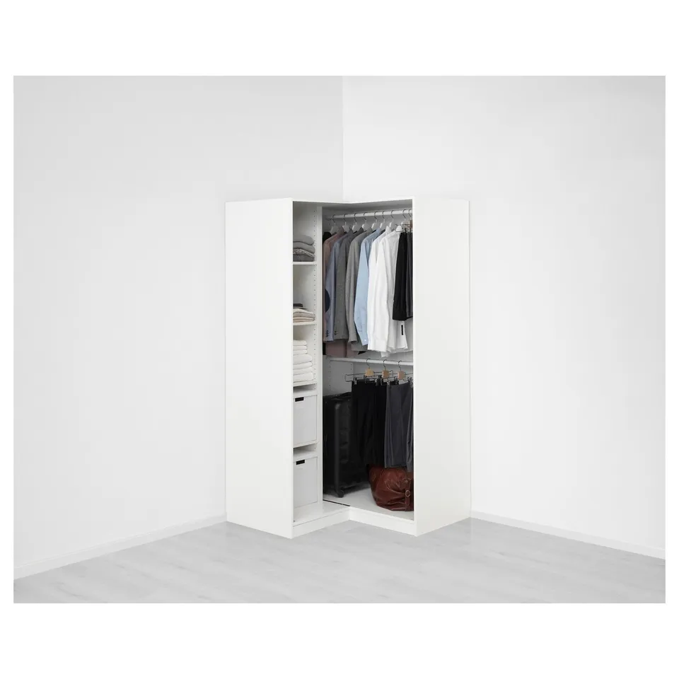 A PAX wardrobe with open doors, revealing organised clothes on hangers and shelves, demonstrating its storage function.