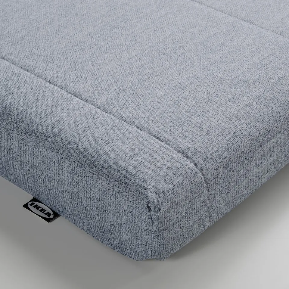Flekkie foam mattress, light grey, IKEA, soft texture, rectangular corner view.