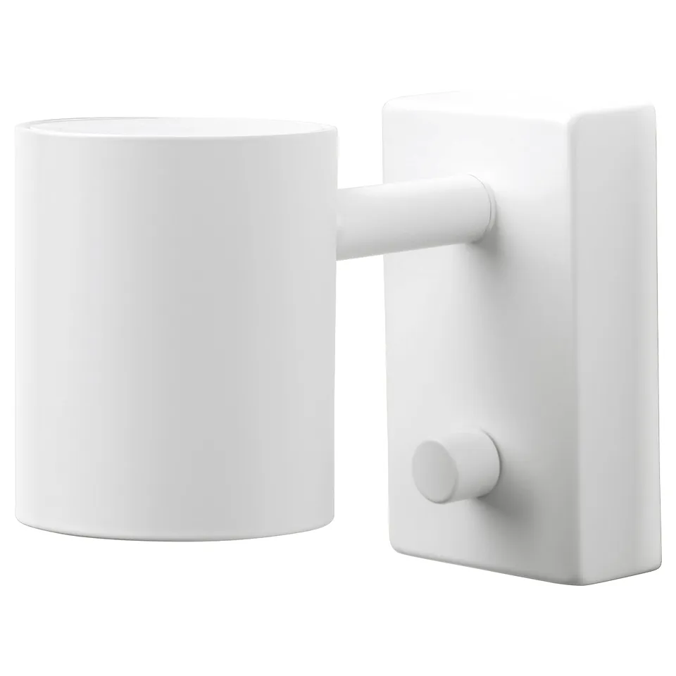 A white NYMÅNE lamp with minimalist design, featuring a cylindrical shade and adjustable arm.
