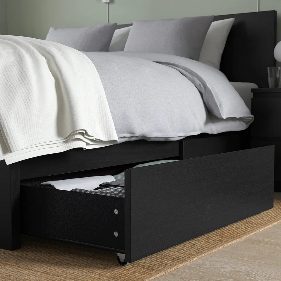 Bedframe with under-drawer storage, castor wheels, and headboard.