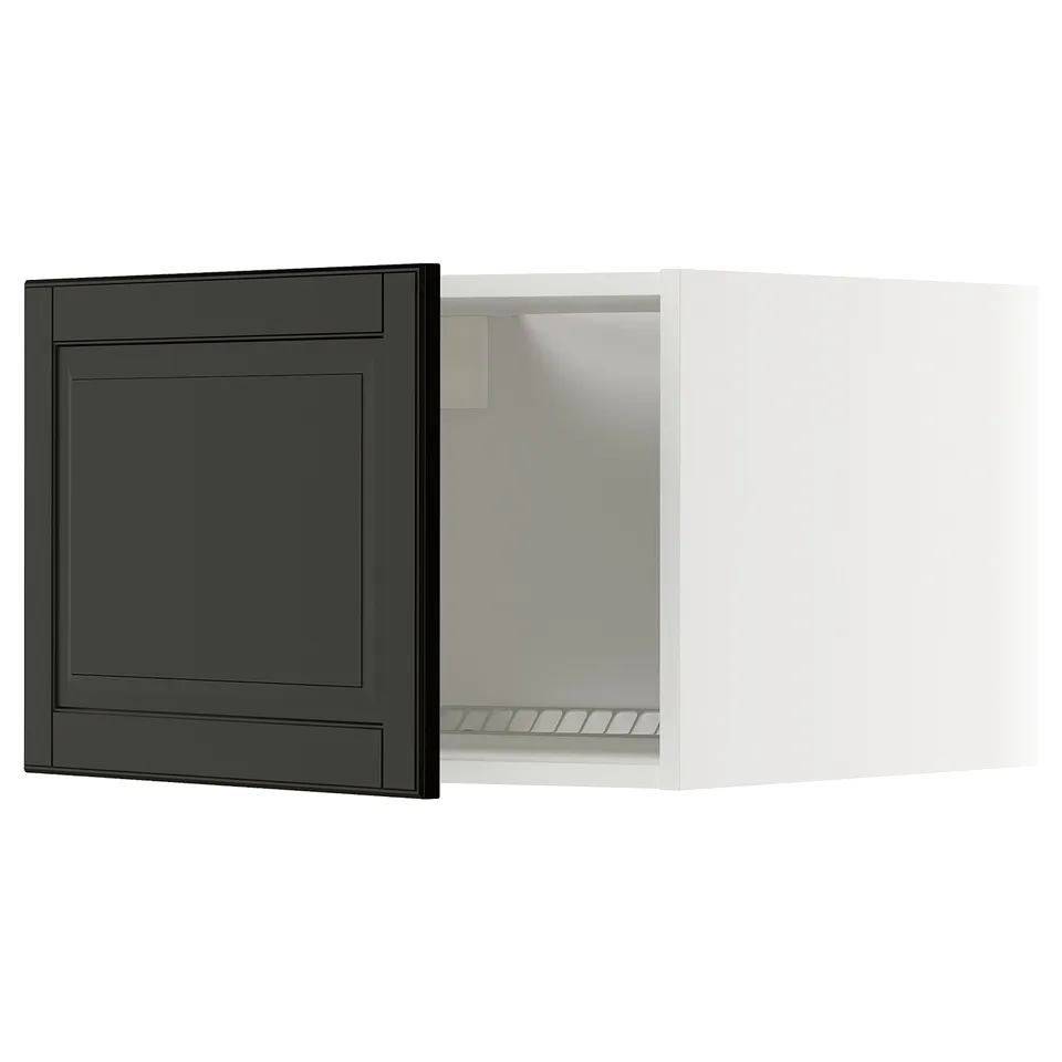 Modern black and white kitchen cabinet with dark door, sleek design.