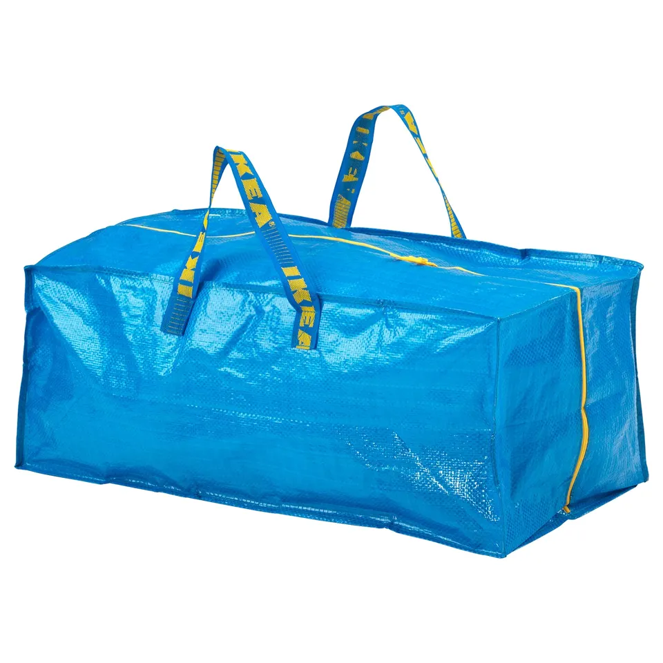 A blue ikea FRAKTA bag with yellow straps, rectangular, made of polypropylene.