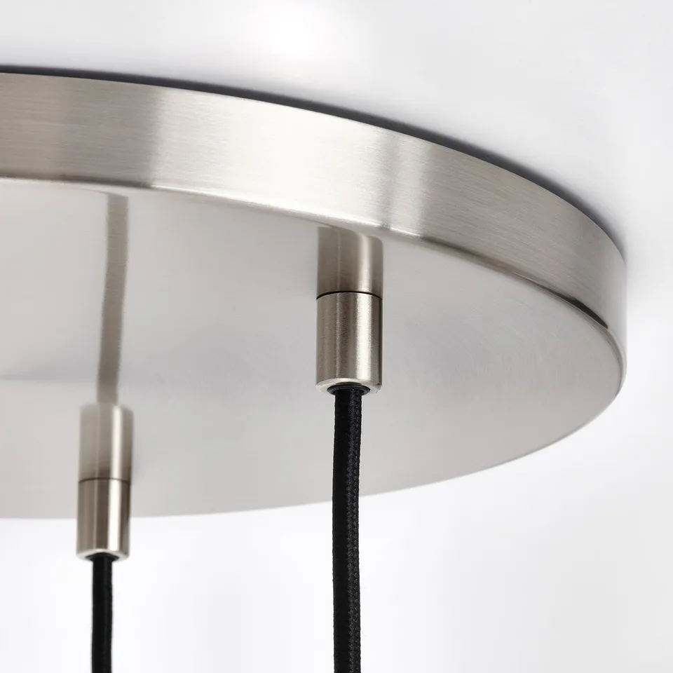 Close-up of modern pendant lamps metal and glass components, showcasing sleek design and quality craftsmanship.