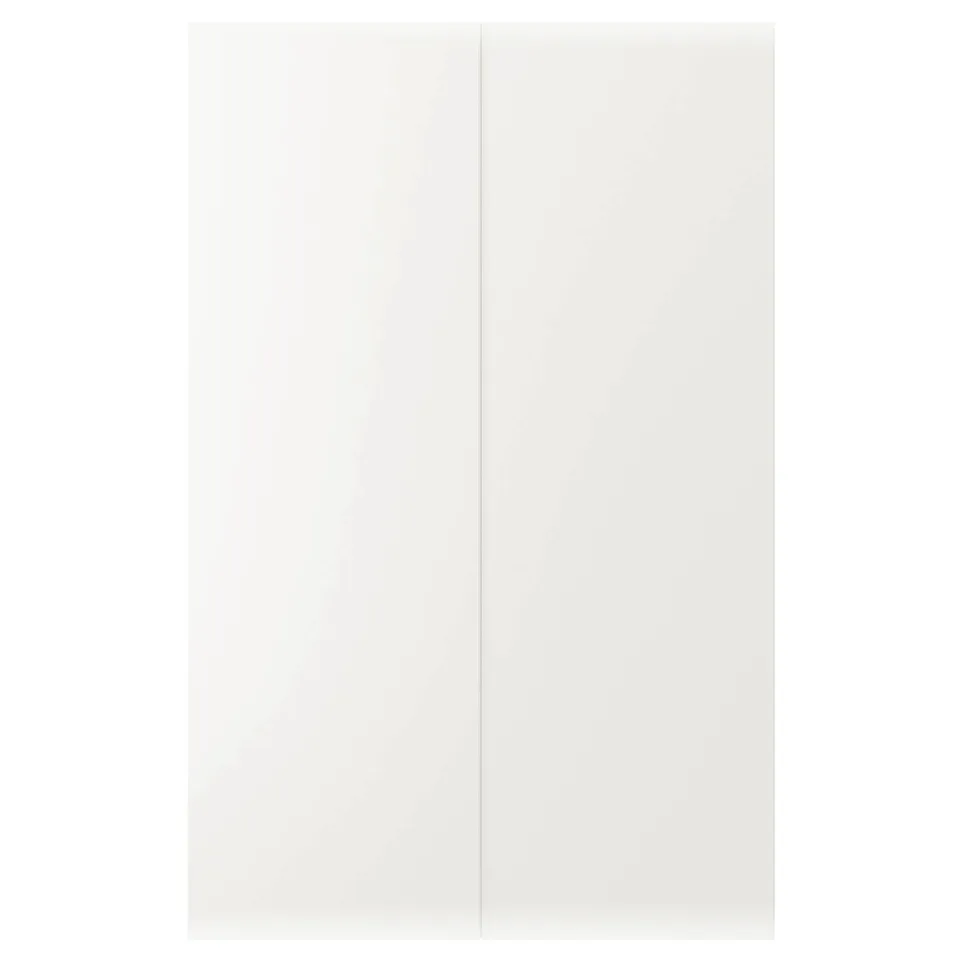 Displays a white cabinet door from the ikea VEDDINGE series, featuring a sleek, modern design with a smooth finish.