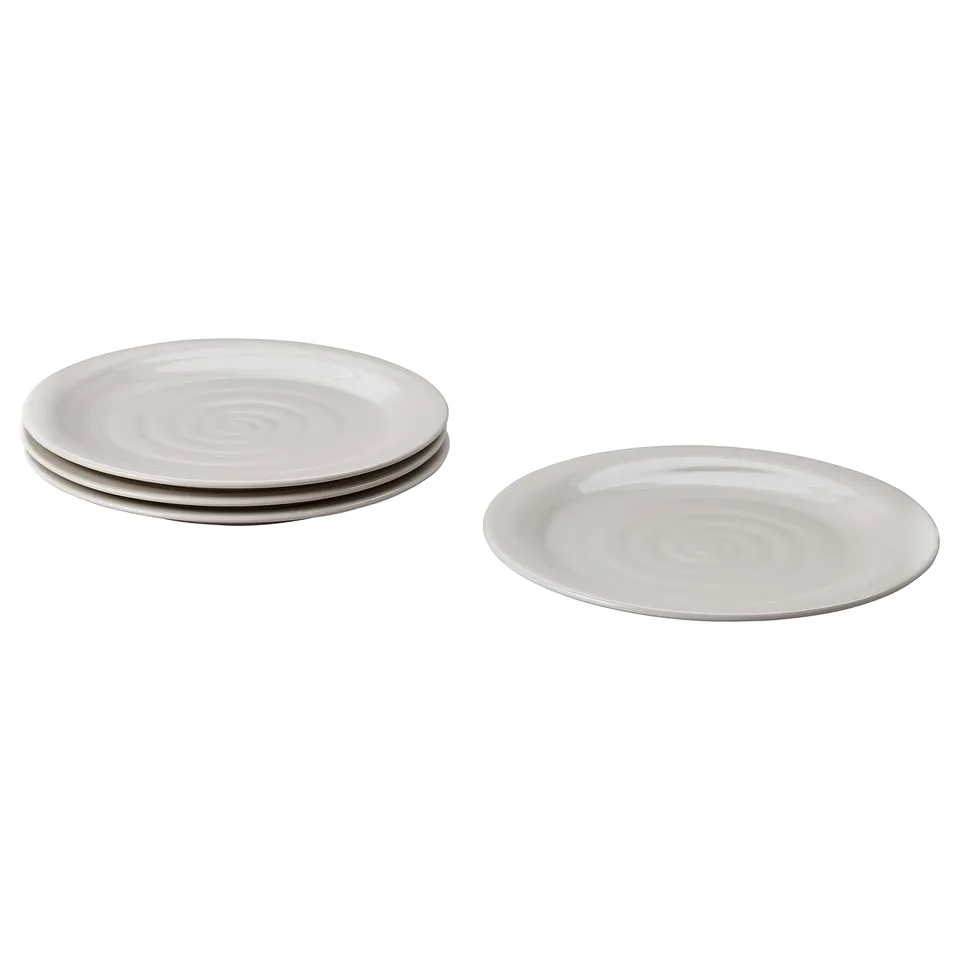 Four grey stoneware plates, one separate, three stacked with spiral centres.