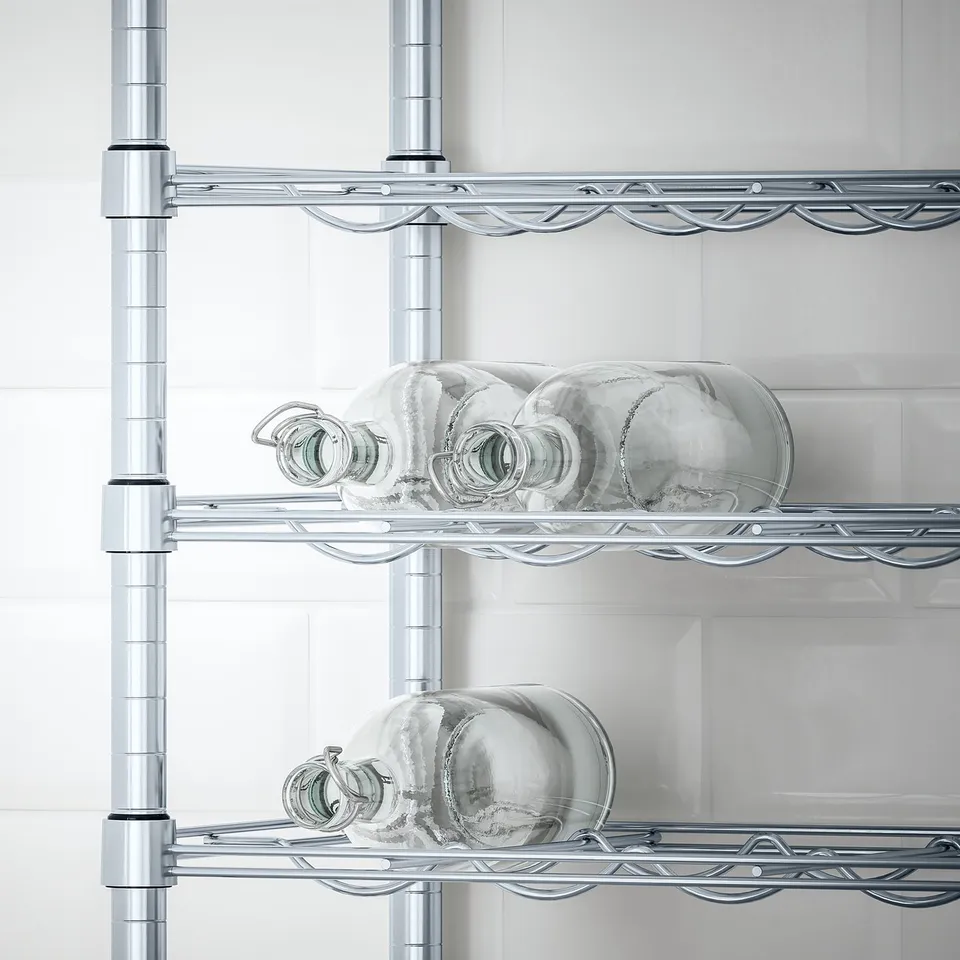 Metal shelving unit holds glass bottles securely, adjustable heights, suitable for kitchen or pantry storage.