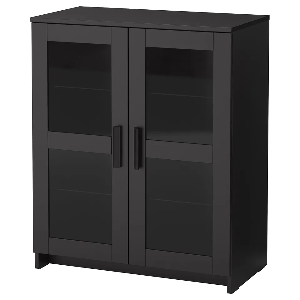 BRIMNES black cabinet with glass doors, modern design. Adjustable shelves, dust-free storage.