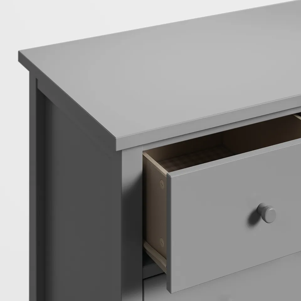Modern grey chest drawer, partial open, minimalist design, light wood finish, smooth edges, safety feature.
