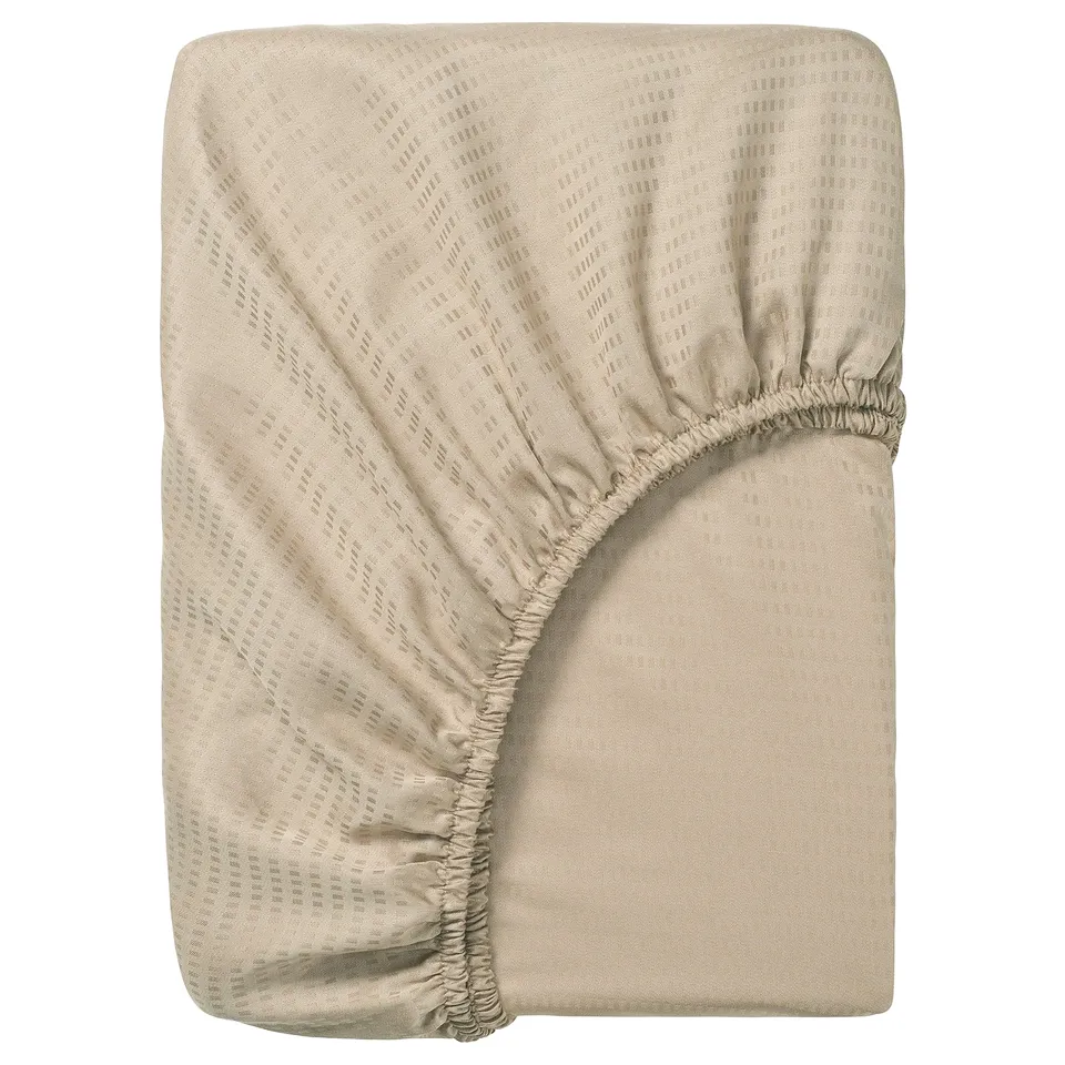 Beige LÄKEVÄNDEROT fitted sheet, smooth dobby texture, rectangular, 100% lyocell material.