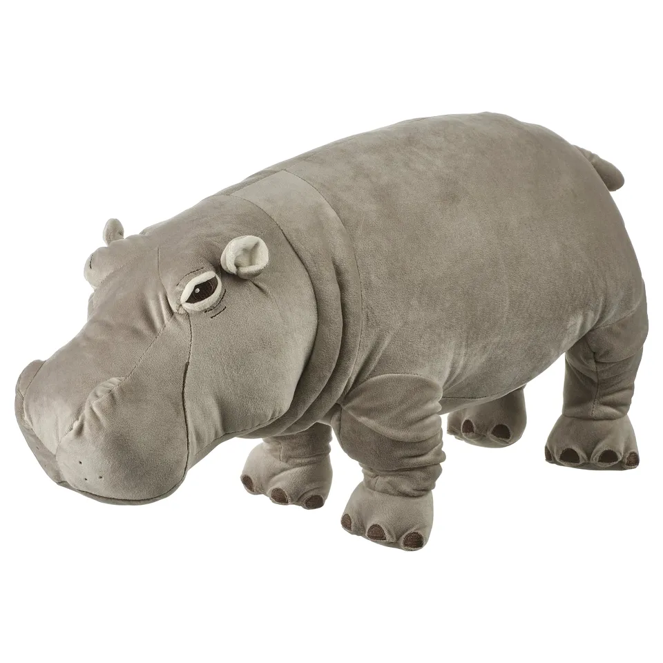 Grey stuffed hippo toy standing on four legs with a round face and large ears. Soft and plush, perfect for cuddling or play.