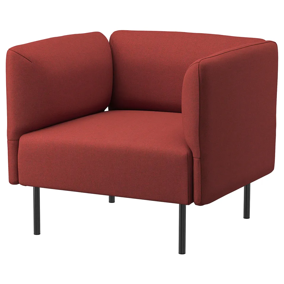 Red corner chair, modern minimalist design, upholstered in textured fabric, four metal legs.