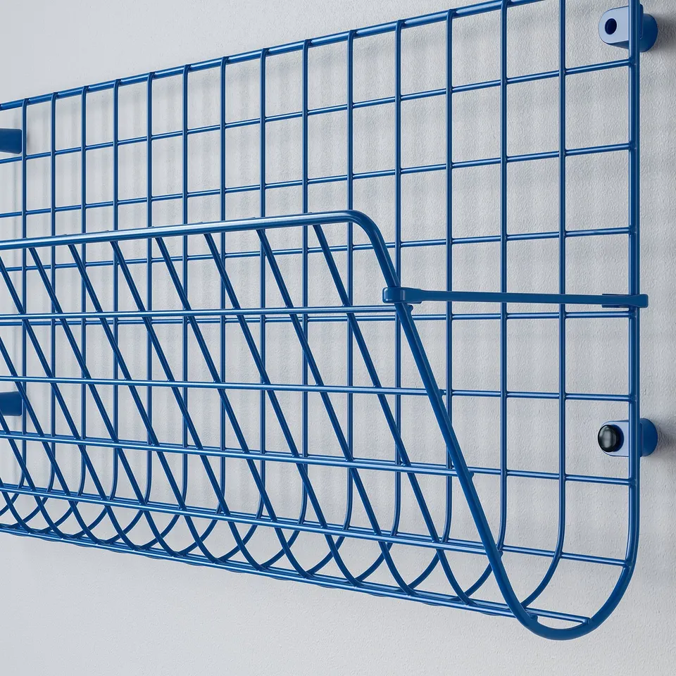 Blue wire mesh storage rack; sturdy, modern design; attached to light-colored wall.