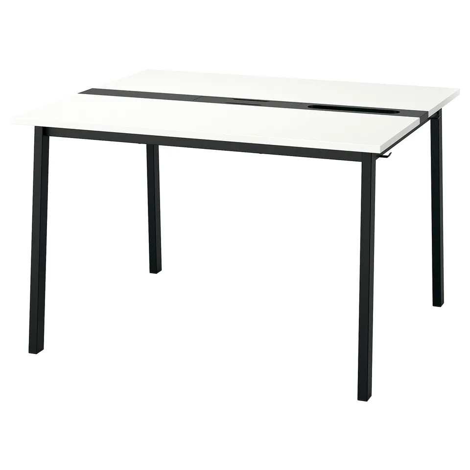 A modern MITTZON desk. It a white top and dark legs. The design is minimalist and functional.