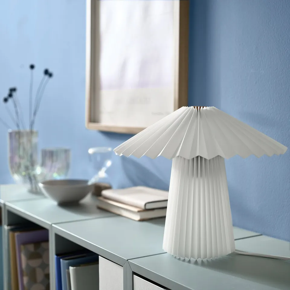 KUDDLAVA white pleated table lamp on shelf, small, modern design.