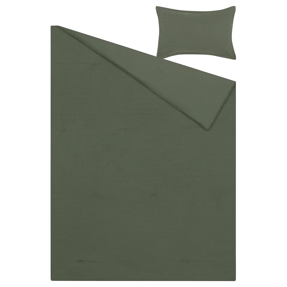 Dark green duvet cover and pillow sham set. Simple, textured waffle design, rectangular shape.