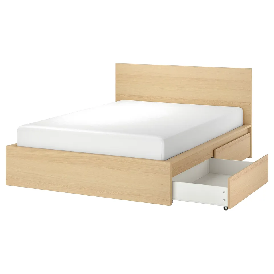 Light wood bed with white mattress, open drawer, clean design.