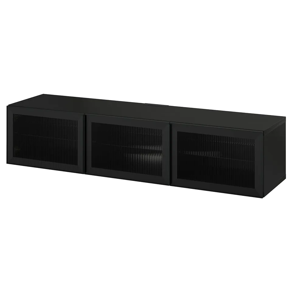 A black BESTÅ tv bench with three glass doors, offering sleek storage and cable management.