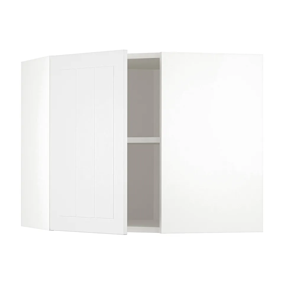 A white METOD kitchen cabinet with one door open, revealing an adjustable shelf inside.