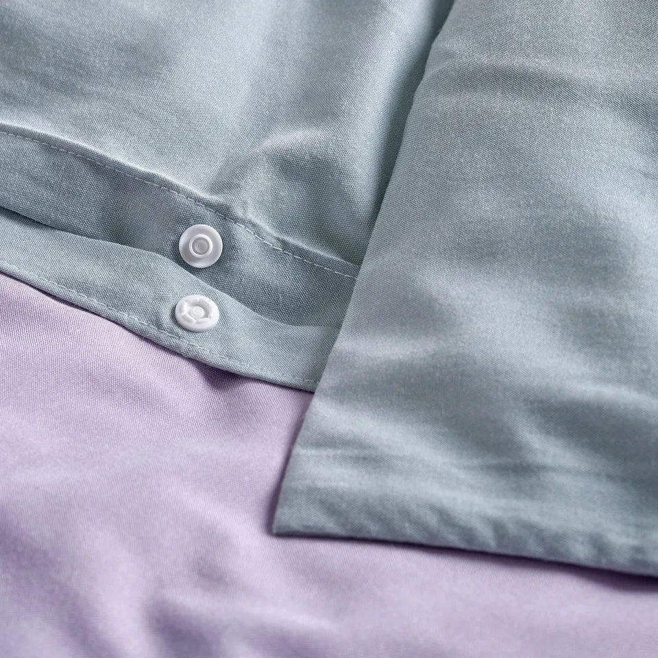 Duvet covers press-stud closure detail, showing bottom opening.