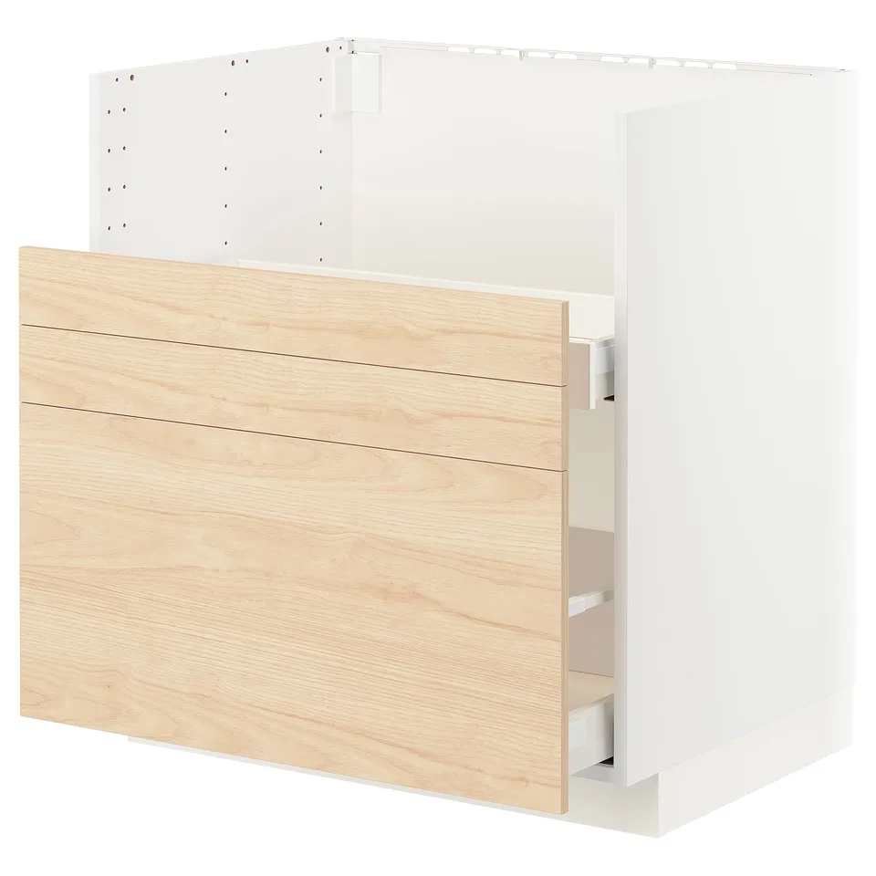 A white METOD kitchen cabinet with light ash wood patterned drawers.