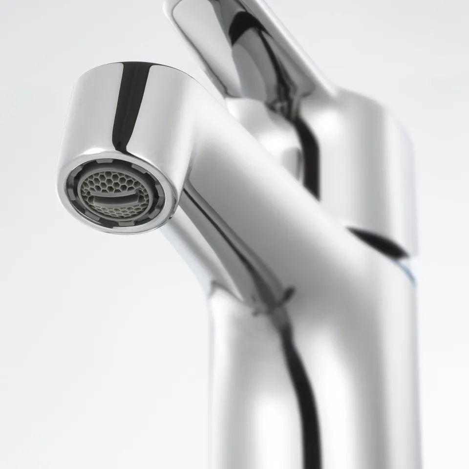 A sleek chrome tap with intricate aerator detail, showcasing high-quality design and finish.