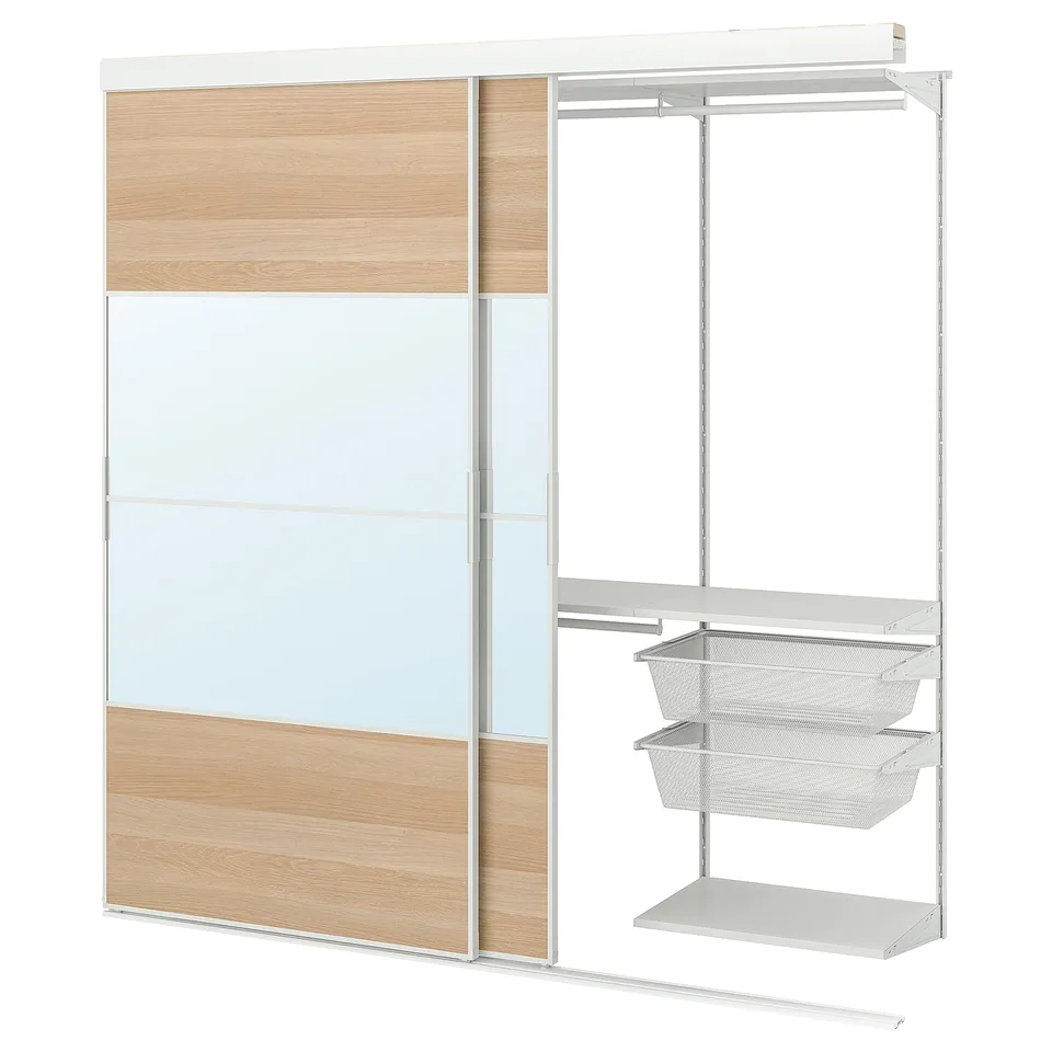 A white SKYTTA wardrobe with glass and wooden panels, featuring mesh drawers and a clothes rail.