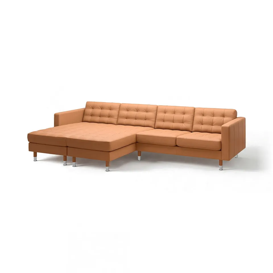 Tan leather l-shaped sectional sofa with chrome legs, button-tufted cushions.