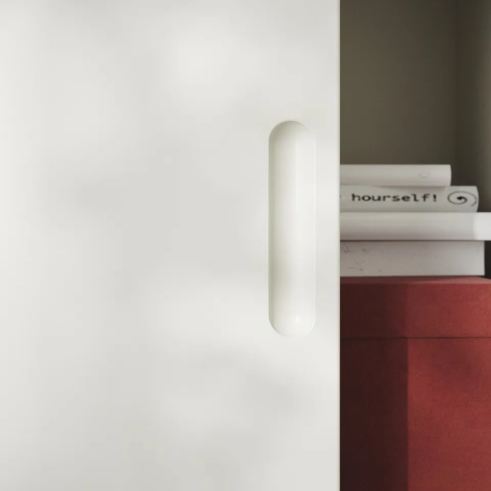 A sleek, white TONSTAD shelf with a minimalist design and cylindrical handle.