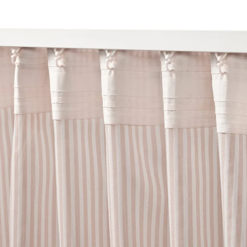 White curtains with stripes offer privacy, reduce glare, and philtre light. Tied back with hooks.