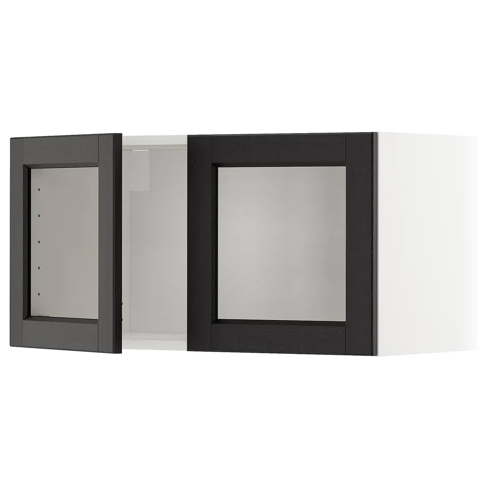 A black stained kitchen wall cabinet with a glass door, framed in ash, and featuring bevelled edges. It has a traditional design.